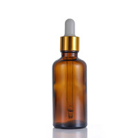 Vente en gros de flacons en verre cosmétiques et d'huiles essentielles de luxe JINHUA de 50 ml, couleur ambre, avec compte-gouttes, estampage à chaud, forme ronde, Shandong, Chine