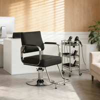 Fauteuil de salon élégant avec base ronde chromée, repose-pieds et dossier inclinable, chaise de barbier hydraulique
