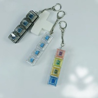 Porte-clés anti-stress en plastique avec clavier mécanique LED et bouton de pression