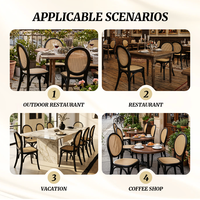Chaise de banquet de mariage à dossier médaillon, cadre noir classique avec assise en rotin naturel pour la location d'événements hôteliers