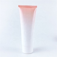 Flacons cosmétiques en verre rose dégradé avec bouchon et applicateur, emballage moderne pour usage industriel