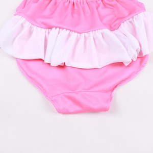 Costume da bagno intero rosa dolce per bambina con volant sul collo e fiocco, senza maniche - Product Image 5
