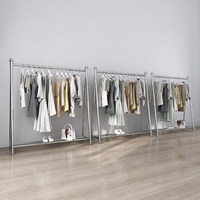 Expositor de ropa de acero inoxidable para tiendas, con barra de suelo y gancho para colgar, ideal para exhibición de ropa de niña.