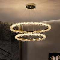 Lustre moderne de luxe en cristal avec cadre doré et éclairage LED pour salons de villas, portes d'entrée, halls d'hôtels et escaliers