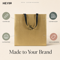 Sac cadeau de luxe personnalisé avec logo, poignée en ruban satiné et estampage à chaud doré pour emballage cadeau de boutique
