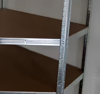 Étagère de rangement industrielle en acier durable à 4 niveaux en forme de L pour entrepôt et présentation en magasin