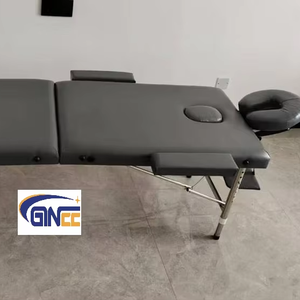 Table de massage pliante GINEE <span class=keywords><strong>en</strong></span> aluminium, portable, pour soins de beauté, acupuncture et thérapies. - Product Image 1