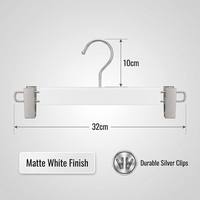 Cintre professionnel robuste antidérapant pour pantalons avec clips métalliques résistants à la rouille, idéal pour organiser pantalons, jupes et jeans