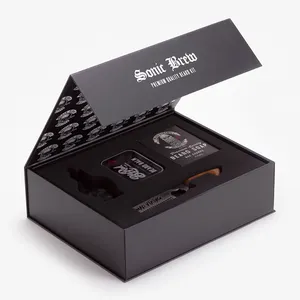 Kotak hadiah kemasan Kit perawatan karton bentuk buku hitam dengan sisipan busa penutupan kustom