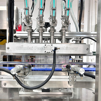Machine de remplissage automatique par gravité PLC à 4 buses pour bouteilles en verre, boissons, produits chimiques, huile, poudre, fûts et emballages métalliques – Garantie 1 an
