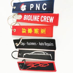 Wholesale Customized Remove Luggage Tag Label Before Embroidery Keyring Flight for logo Woven Keychains - Product Image 2