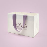 Sac en papier kraft écologique personnalisé de luxe pour vêtements, sac à poignée conçu pour le shopping et l'emballage de cadeaux