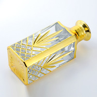 Vente en gros de bouteilles vides de parfum gravées aux UV de 250ml bouteille d'affichage de parfum plaqué or bouteille de parfum de luxe personnalisée