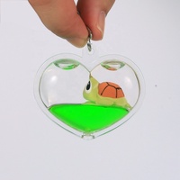 Nouveau design créatif porte-clés en acrylique liquide mignon de dessin animé en forme de cœur avec flotteur en résine 3D, fabrication en gros, cadeau souvenir