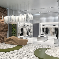 Vitrines de boutique modernes sur mesure, en acier inoxydable, pour l'aménagement intérieur de magasins de vêtements.