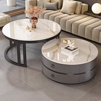 Ensemble de tables basses gigognes rondes modernes avec plateau en pierre frittée, 2 pièces, avec tiroir de rangement pour petit appartement.