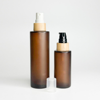 Ensemble de bouteilles en verre de luxe de 30 ml 50ml 100ml Flacon cosmétique en verre dépoli ambré avec vaporisateur à pompe en bambou