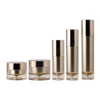 Ensemble de flacons cosmétiques en acrylique avec tête de pompe à vide dorée pour lotions, crèmes et onguents – Matériaux d'emballage pour petites séries