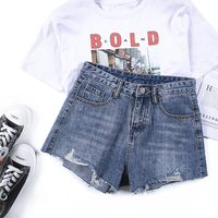 Short en jean vintage délavé personnalisé pour femme, taille haute, design déchiré et vieilli, bords irréguliers effilochés