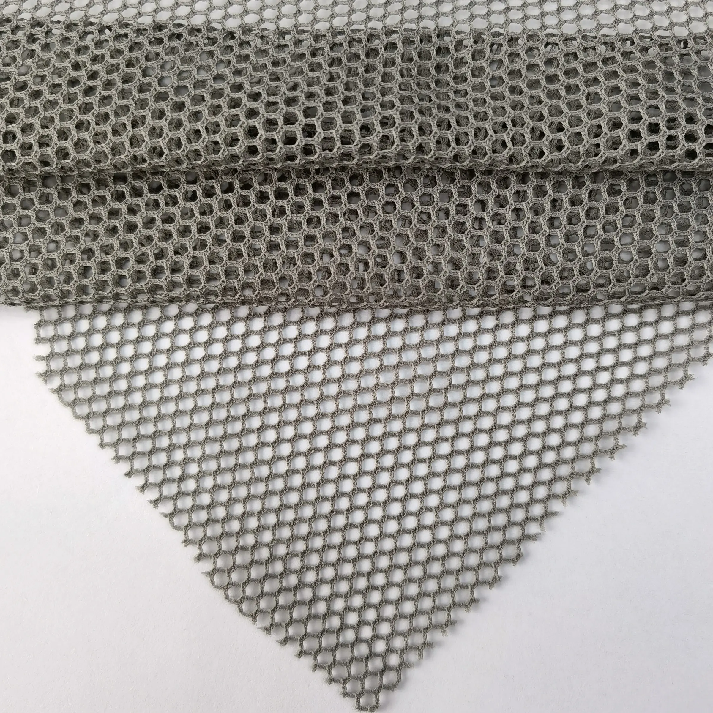 Tela de malla de poliéster de punto de panal hexagonal de poliéster ligero súper suave para ropa interior
