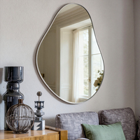 Table console noire personnalisée asymétrique avec cadre doré grand miroir mural simple et élégant pour la maison miroir d'inspiration art déco