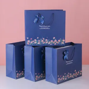 Luxury brand custom logo gift paper bag for clothes blue matte garment clothing boutique packaging bags with ribbon bow