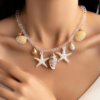Collier de plage bohème transfrontalier : Bijou pendentif en faux perles, coquillages, étoiles de mer et conques