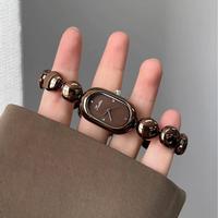 Montre pour femme au design créatif de grains de café, style bracelet rétro, marque artistique, haute beauté, nouvelle tendance 2025, célébrité d'Internet populaire