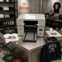 Imprimante textile DTG Qinyu A3 à double station, haute vitesse, pour l'impression de t-shirts, polos, sweats à capuche et vêtements personnalisés, la plus populaire