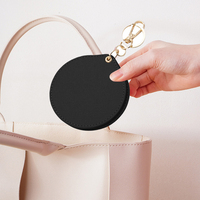 Miroir de poche rond en gros avec porte-clés, couvercle en cuir végétalien pivotant, logo personnalisé, marque privée, mini miroir portable pour sac