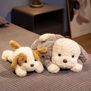 Juguete de perrito de peluche suave personalizado de alta calidad para niños Nueva cara sonriente tumbado Animal de peluche decorativo en 2 colores para elegir - Product Image 1