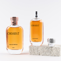 Vente en gros de flacons de parfum transparents ronds plats de luxe personnalisés de 50 ml avec boîte et vaporisateur à pompe