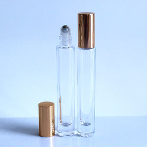 Botella de Vidrio Transparente Redonda de Lujo de 1/3 oz (10 ml) con Base Pesada y Tapa Atomizadora Dorada, Plateada o Negra para Aceite de Perfume - Product Image 2