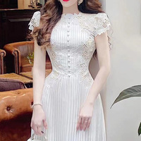 Robe d'été 2026 TKS en dentelle brodée pour femme, style élégant et taille ajustée