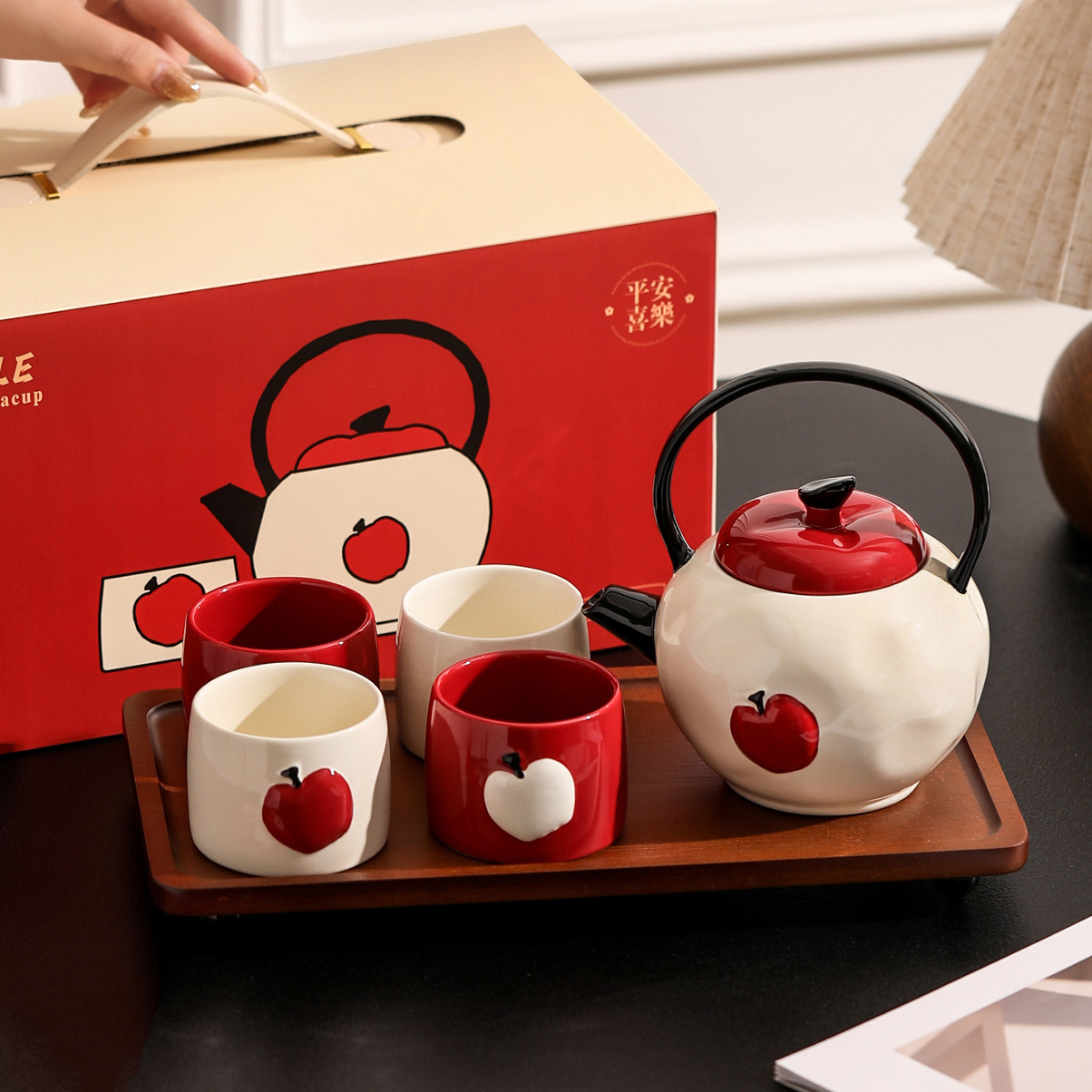 one teapot with 4 cups and wood tray