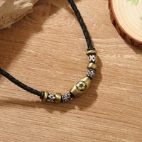 Pendentif spirale vintage sur collier en cuir tressé unisexe, pendentif métallique double anneau style bohème, cadeau
