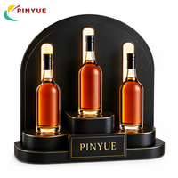 Présentoirs de vente au détail personnalisés, présentoirs de comptoir en acrylique noir avec éclairage LED pour les cosmétiques, les parfums et la promotion de la marque