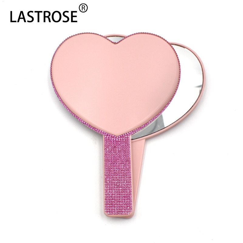 Miroir en forme de cœur rose avec diamant rose vif