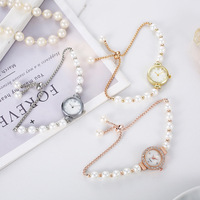 Montre à quartz pour femme avec bracelet fin en perles de mode incrustées de diamants, cadran rond en nacre, bracelet extensible