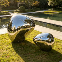 Sculpture abstraite en acier inoxydable poli miroir, forme de galet métallique, pour la décoration extérieure de jardin et de paysage