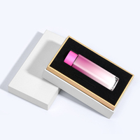 Boîte rigide de luxe 2026 blanche/noire avec manchon et accents dorés, insert en EVA pour emballage de flacons de parfum et de kits de soins de la peau