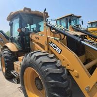 Chargeuse-pelleteuse JCB 4CX d'occasion en bon état, en stock, pour travaux de terrassement et de manutention de matériaux
