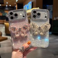 Coque de téléphone à chaîne papillon dégradé avec nœud et coquillage pour iPhone 17 16 15 Pro Max, avec breloques diamantées et lanière scintillante