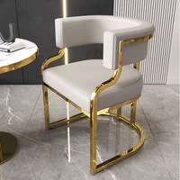 Fauteuil d'hôtel moderne blanc rembourré avec accoudoirs, structure métallique, dossier solide, idéal pour hall d'hôtel et appartement