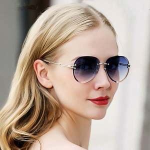 Lunettes de soleil ovales sans monture à verres dégradés style vintage 2022 pour femmes - Product Image 1