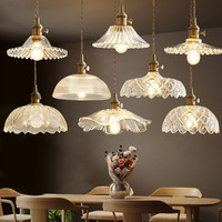 Estilo nórdico moderno minimalista latón colgante luz creativa hoja de loto cristal LED cabecera cobre Villa hogar Oficina