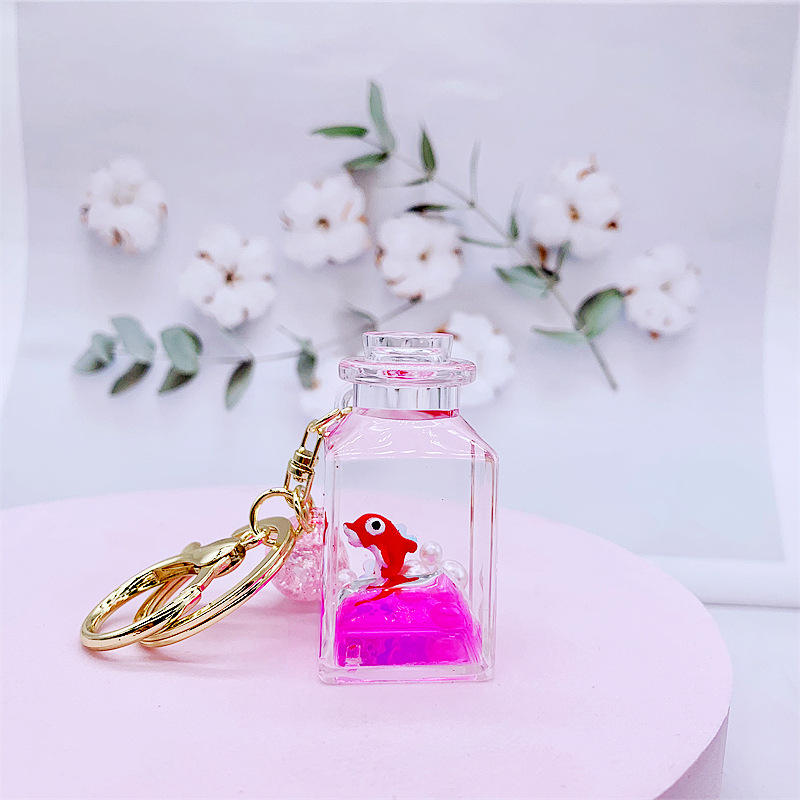 Dauphin rouge-liquide rose