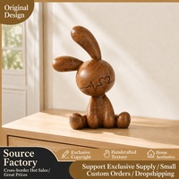 Figurine de lapin en résine à effet grain de bois rustique avec motif cœur pour la décoration de table et d'étagère dans le salon, vente en gros