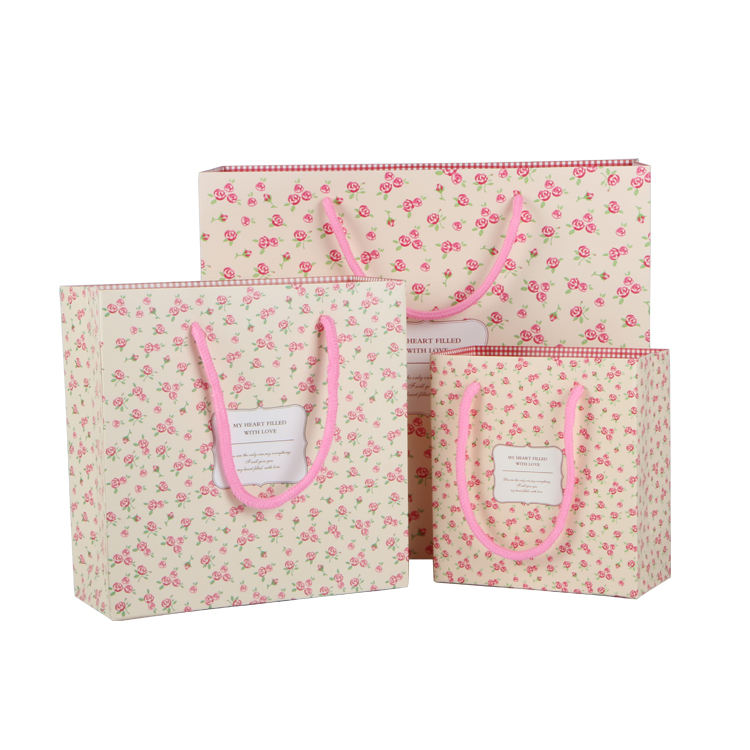 Pink eco friendly luxury paper packing bag for gift jewelry with ribbon handle