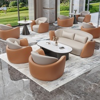 Ensemble de canapés commerciaux haut de gamme en cuir noir et marron avec table basse en marbre, mobilier pour hall d'hôtel